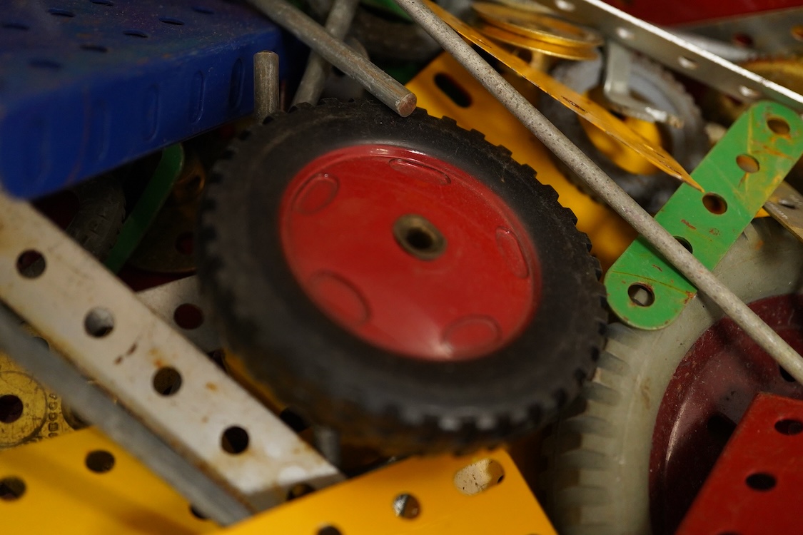 A large quantity of early Meccano construction parts, including a variety of specialist parts from the earliest sets produced and the original box for set No.3